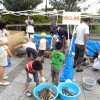 昨年度鶴見川流域センターで実施した防災イベント、火起こし体験のようす。